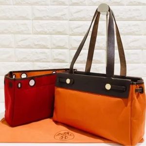 Hermès double bag canvas bag in red and orange, little used, small details
